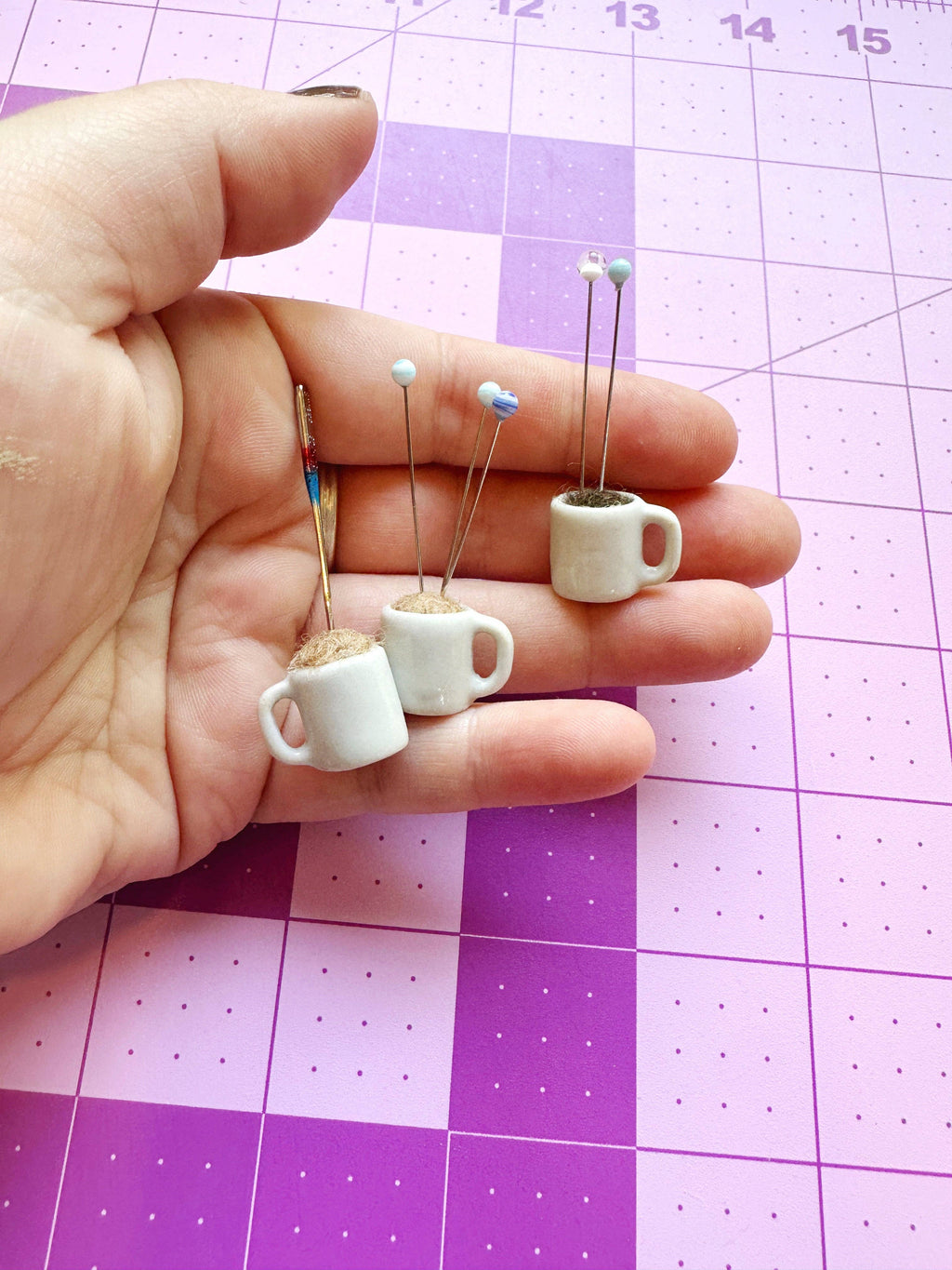 Coffee mug pin catcher