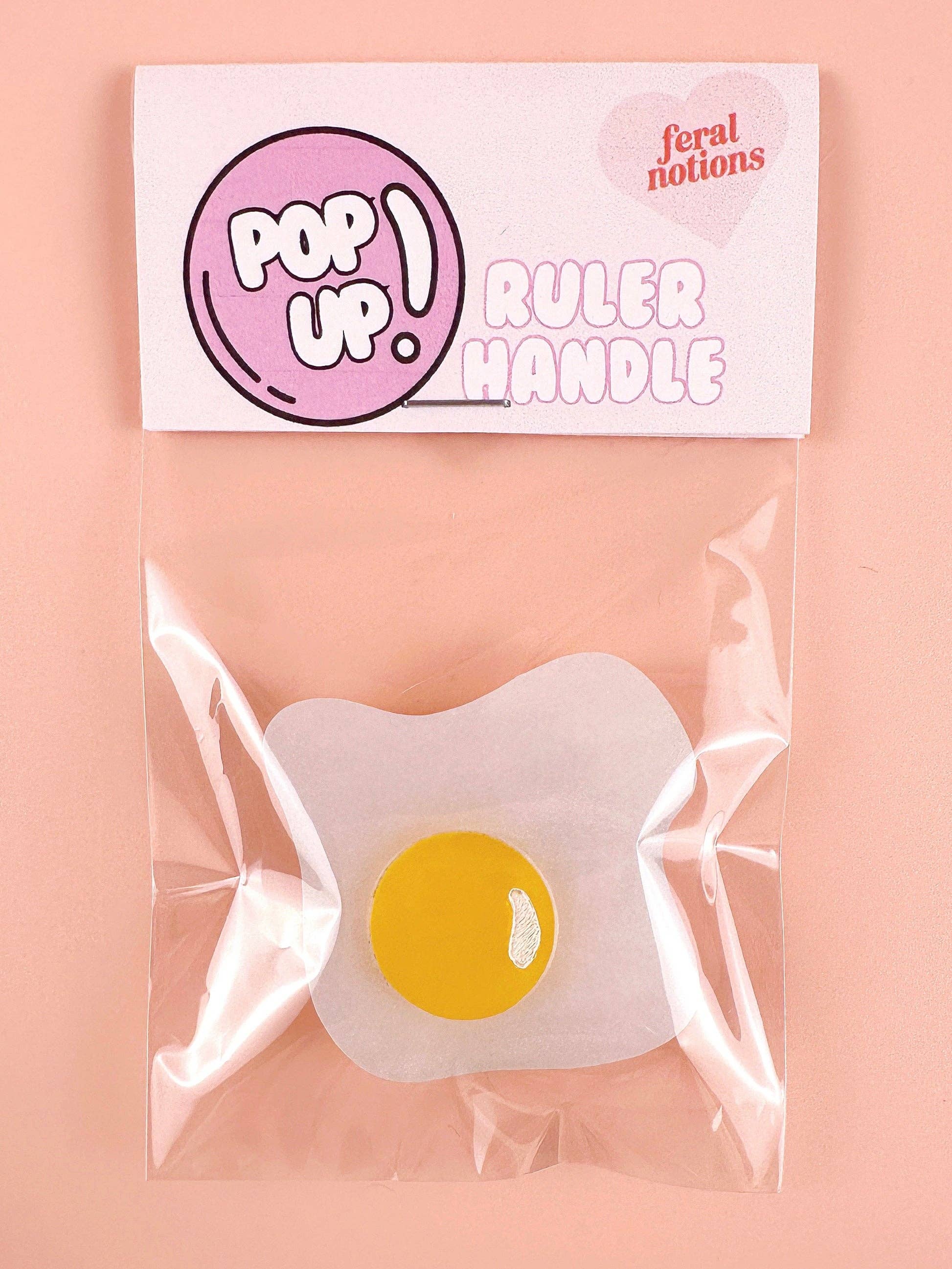 Over easy egg pop-up ruler handle