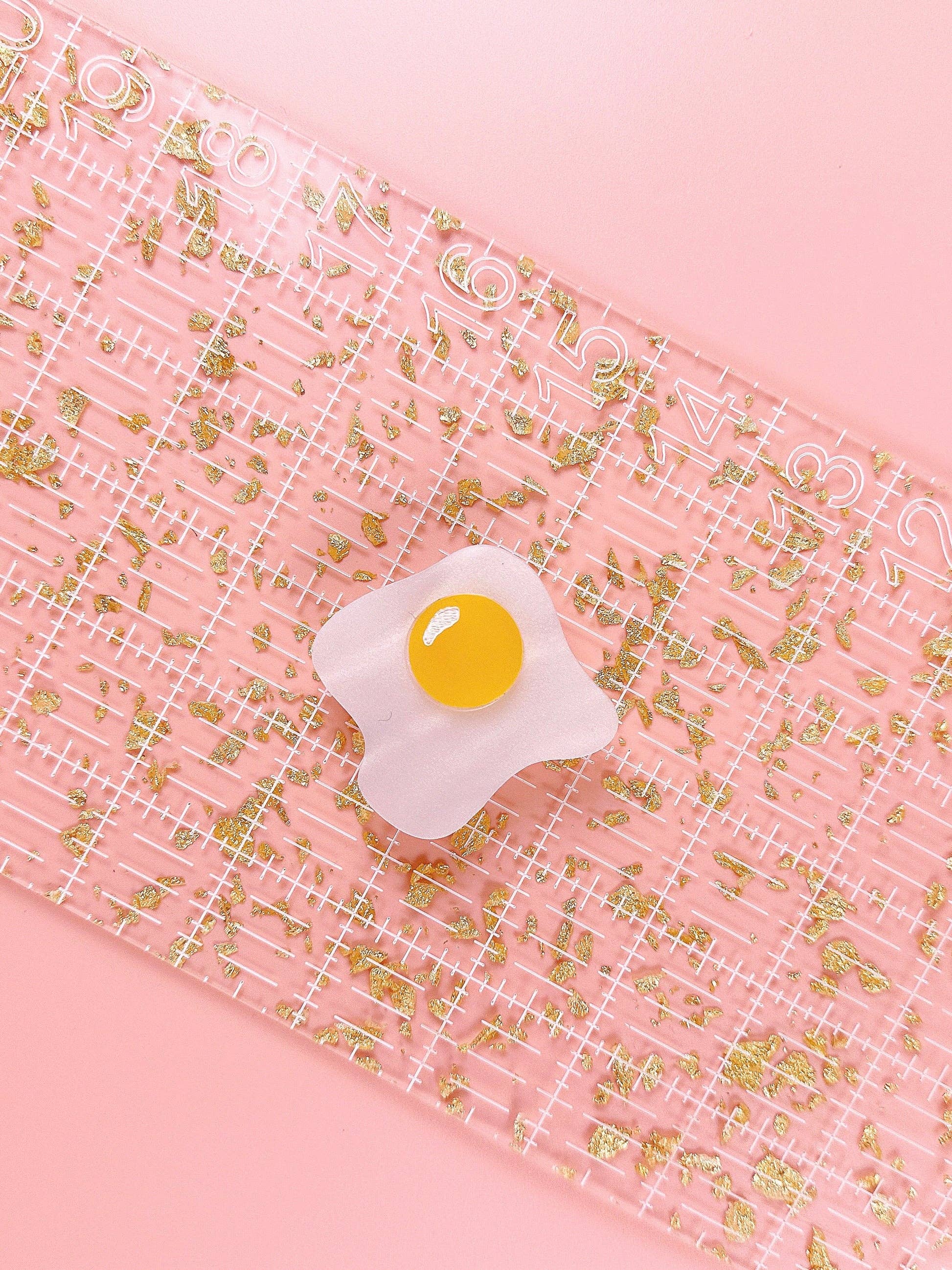 Over easy egg pop-up ruler handle